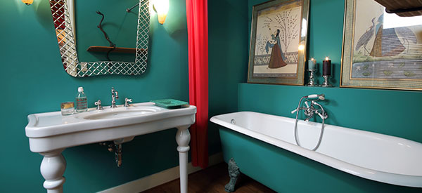 A bathroom can have a statement wall using artistic tiles as an expression of your taste and to make a corner stand out