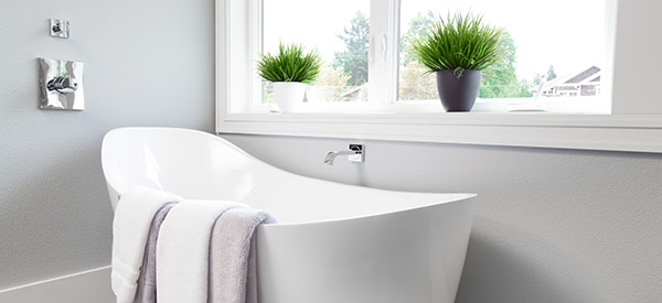 Relax in a freestanding tub at the end of a tiring day.