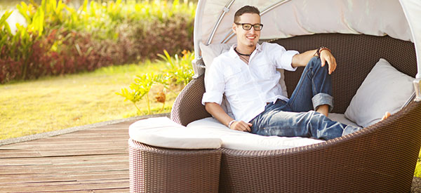 Create a restful outdoor nook with a daybed made of your preferred natural materials like rattan or wicker.