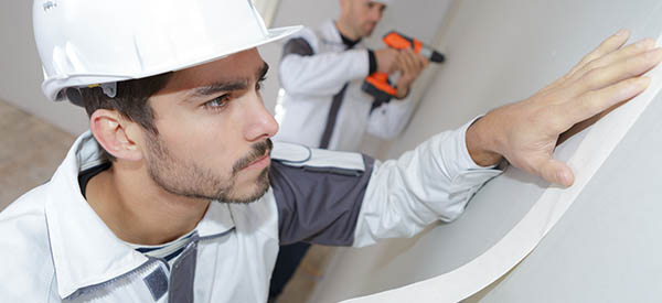 Professional contractors offer high-quality services for drywall taping for a smooth and durable finish.