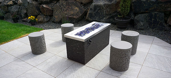 Add a fire pit and stone benches to your patio area.