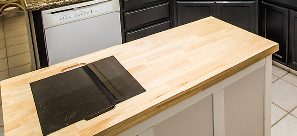 A butcher block is made of wood and costs much less than other types of countertops.