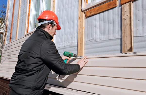 Exterior siding installation by a professional.