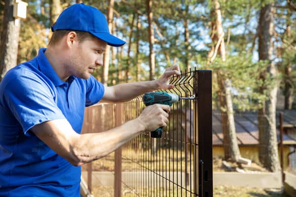 Fencing a property with professionals.