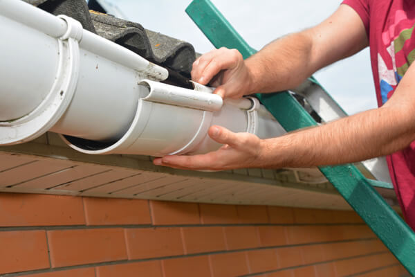 Gutter repair or replacement offered by professional roofers.