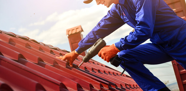 Professional roofer repairing a roof.