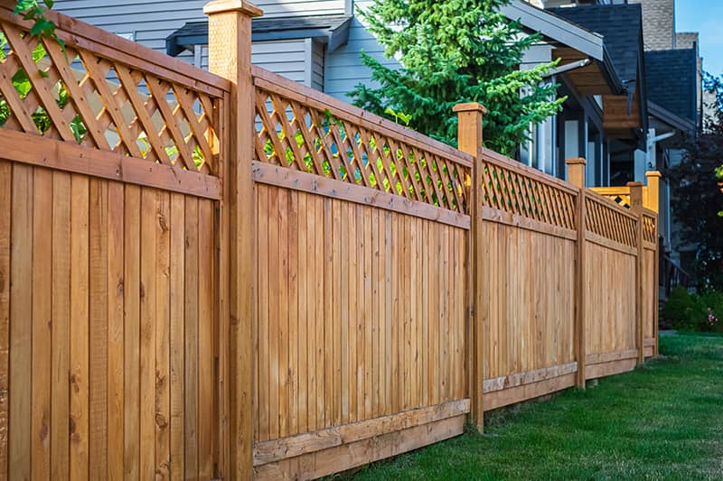 Wooden fence for privacy and aesthetic value.