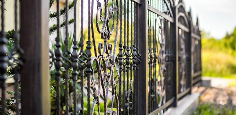 Wrought iron fence for durability and elegance.