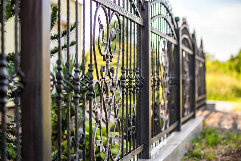 Wrought iron fence for durability and elegance.