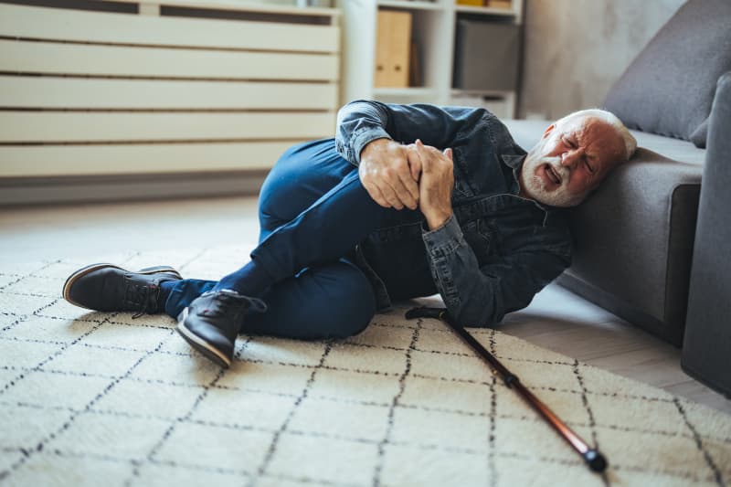 Elderly man falls on the floor.