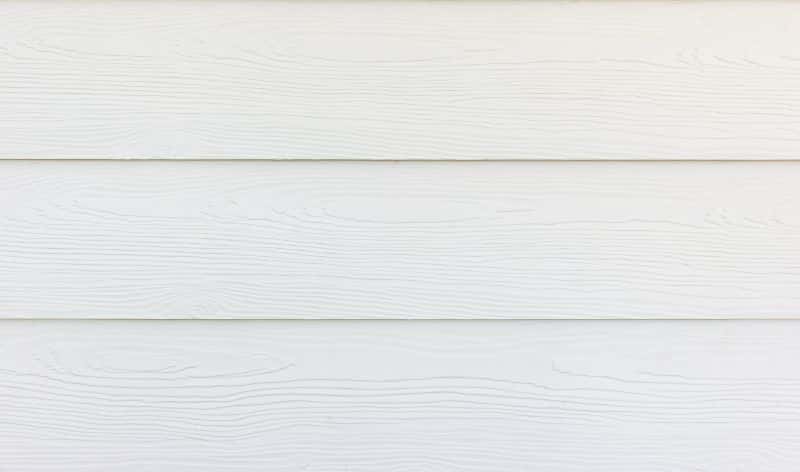 Fibre cement siding in white color and texture