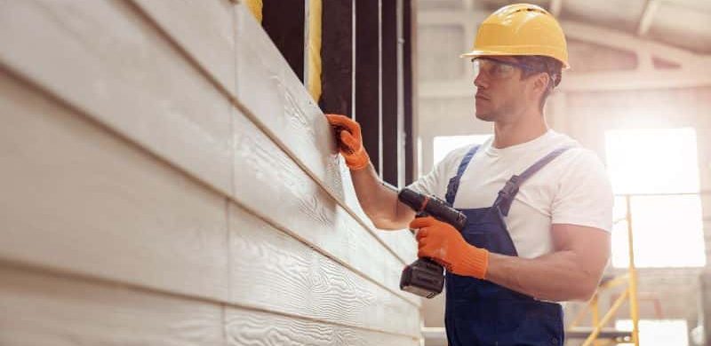 House siding installation by a professional worker
