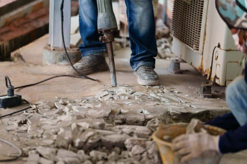 Jackhammer being used to break up concrete floor