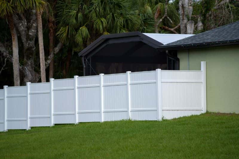 Stylish vinyl picket fence surrounding the home