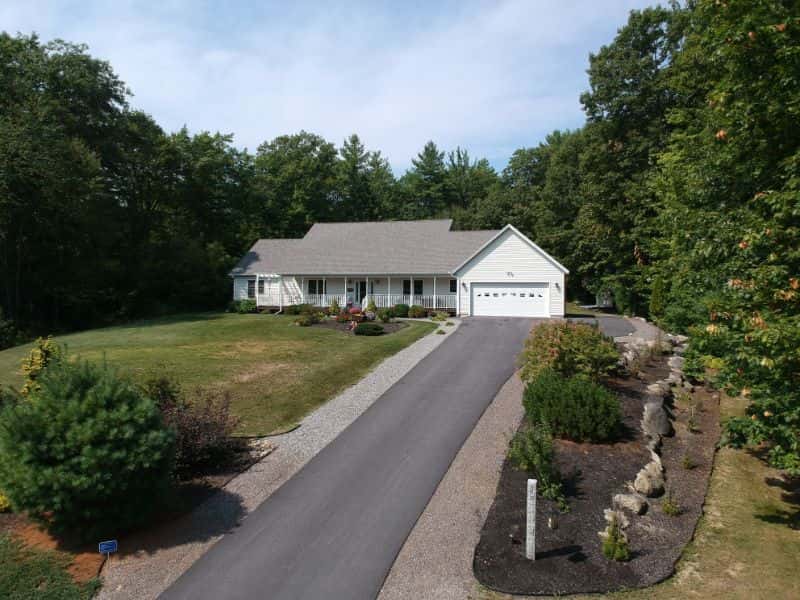 Modern farmhouse with asphalt driveway