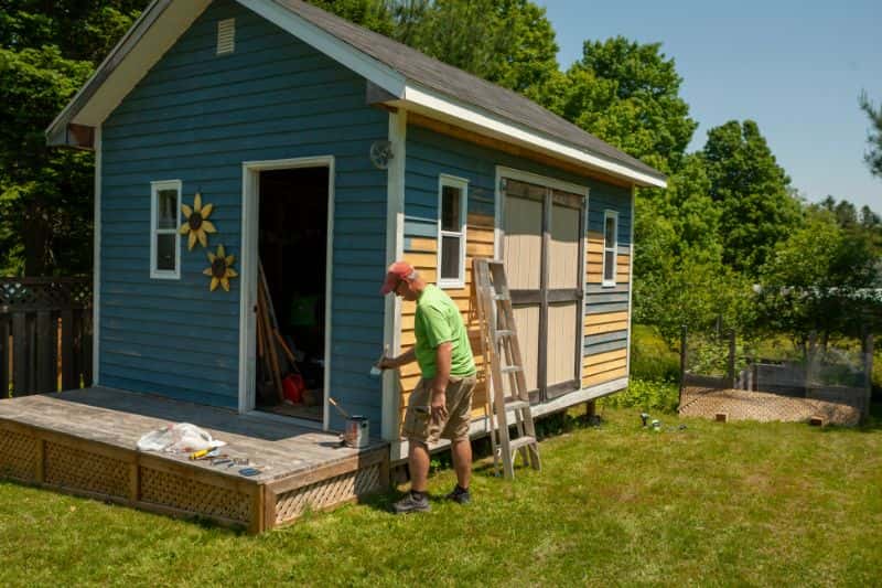 Simple wood and storage shed in blue paint