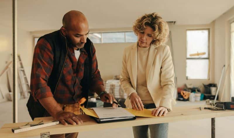 Homeowner discussing the renovation with a contractor